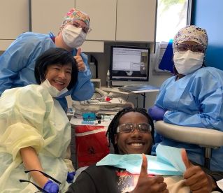Photo of Boca Raton dentist, Jennifer E Wong-Looi, and her team at "Free Dentistry Day" in April 2024